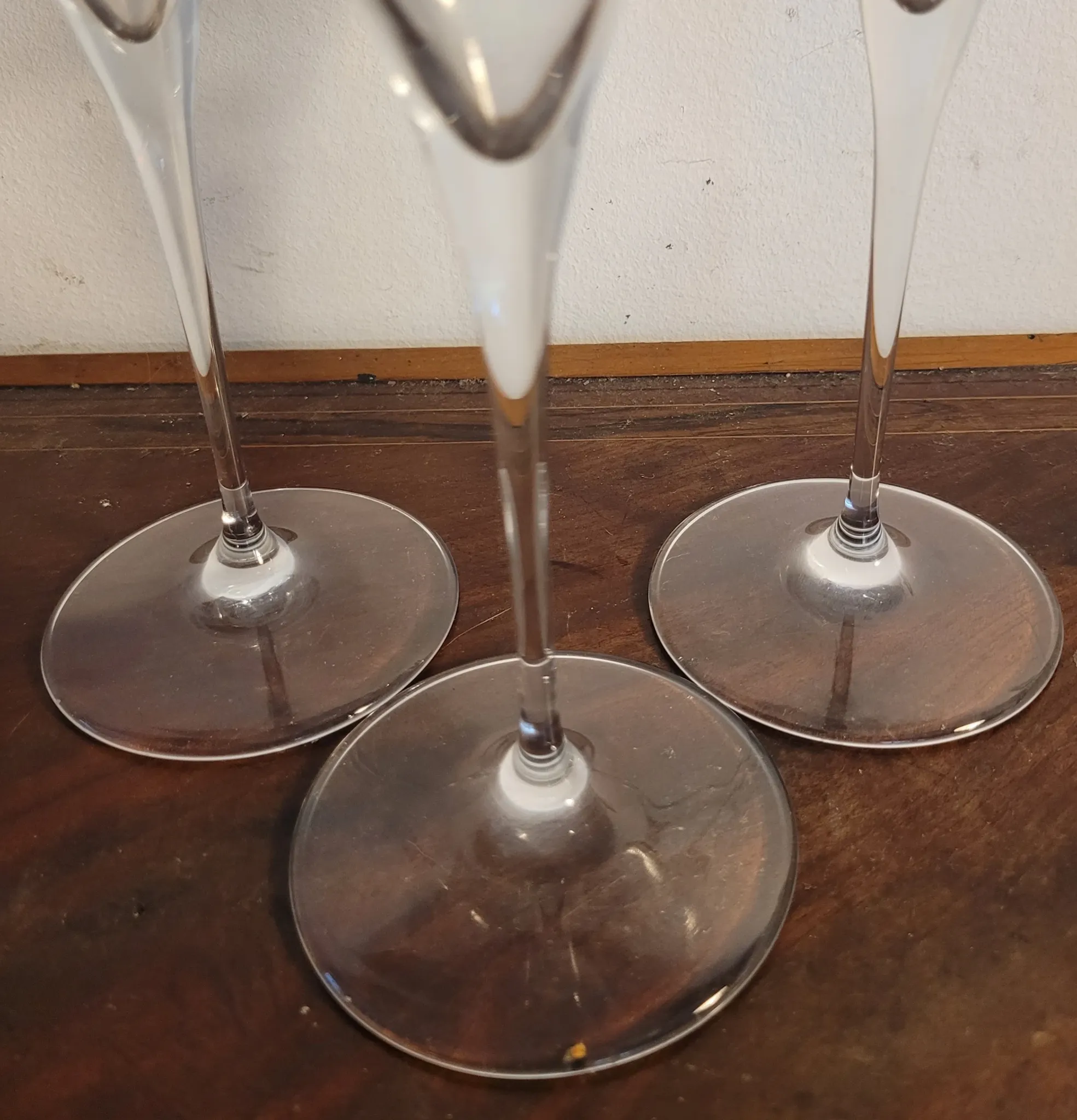 3 large crystal champagne flutes. No brand.