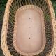 Vintage wicker cradle on casters