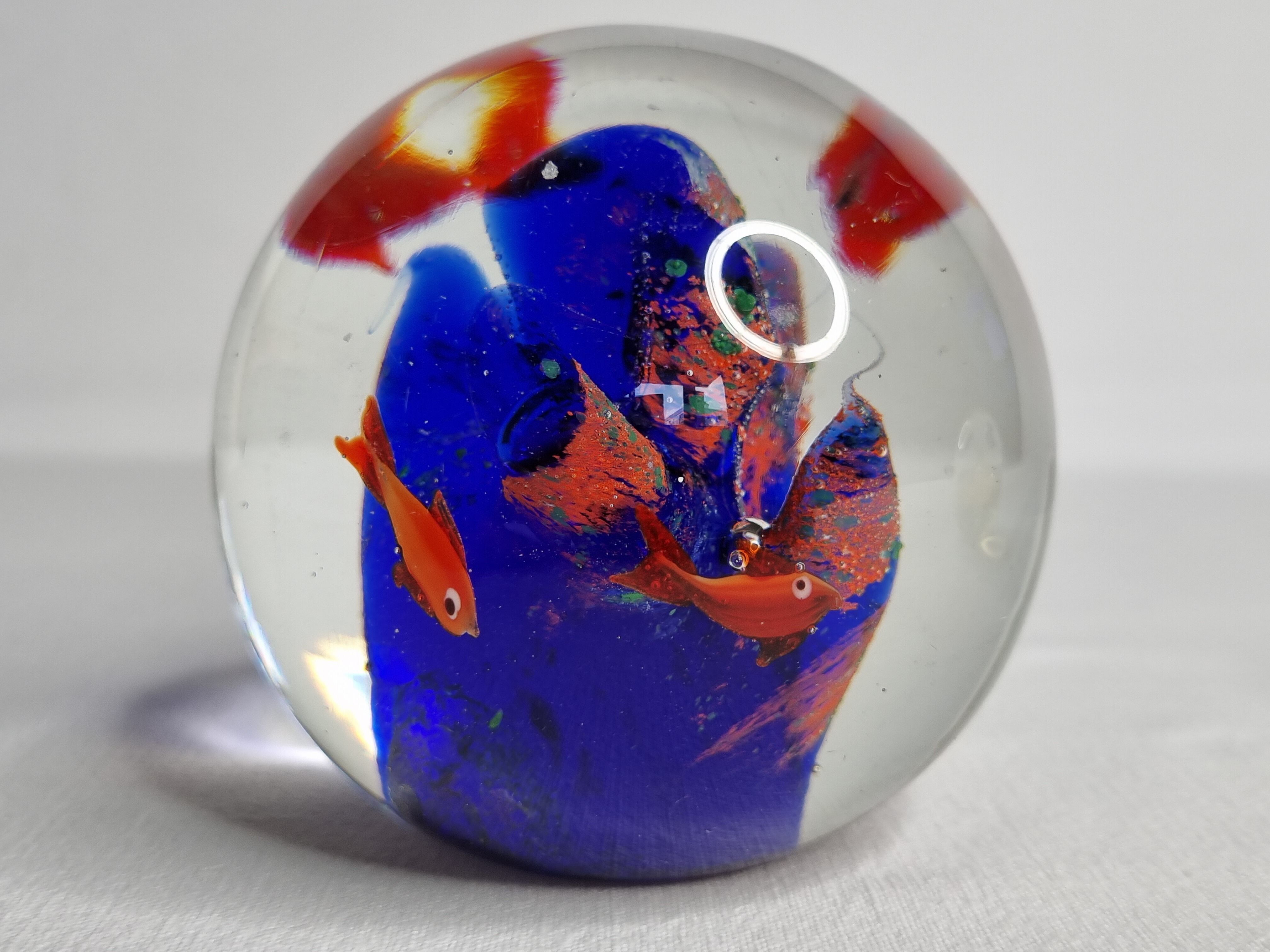 Set of two sulphides, glass paperweight with fish decorations