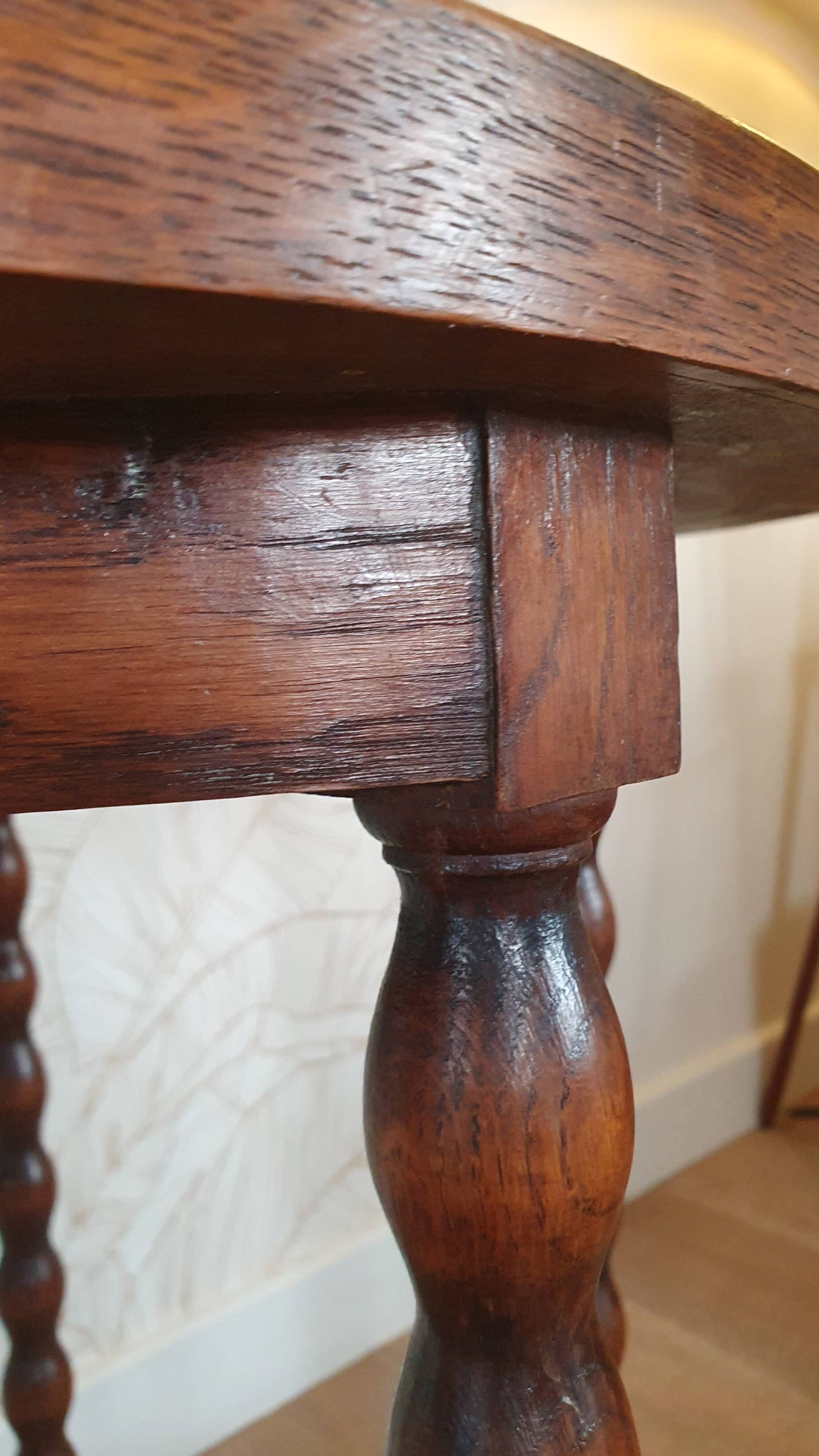 Round wooden table with beaded legs