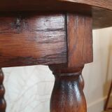Round wooden table with beaded legs