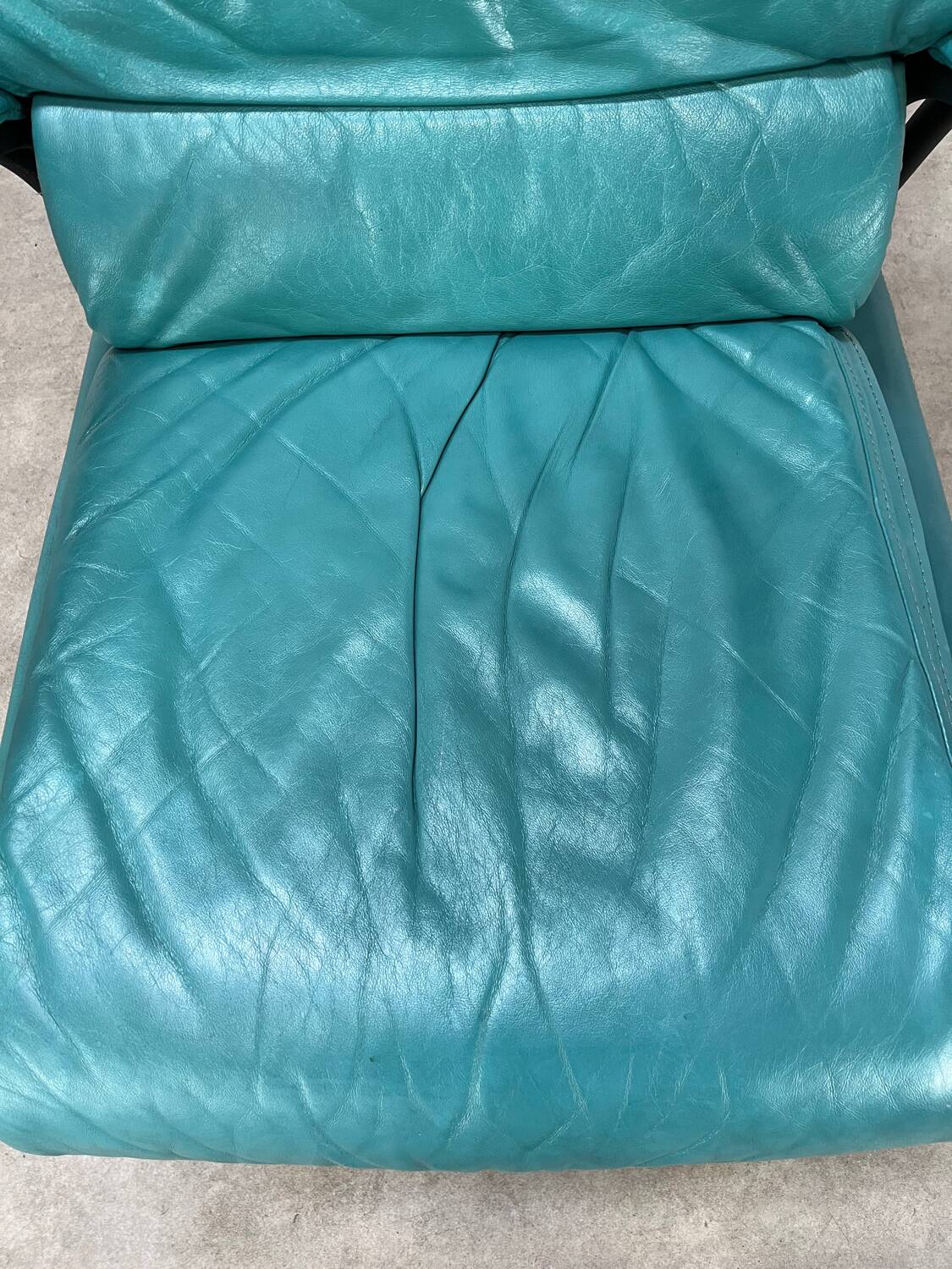 Postmodern design armchair and ottoman, 80s leather