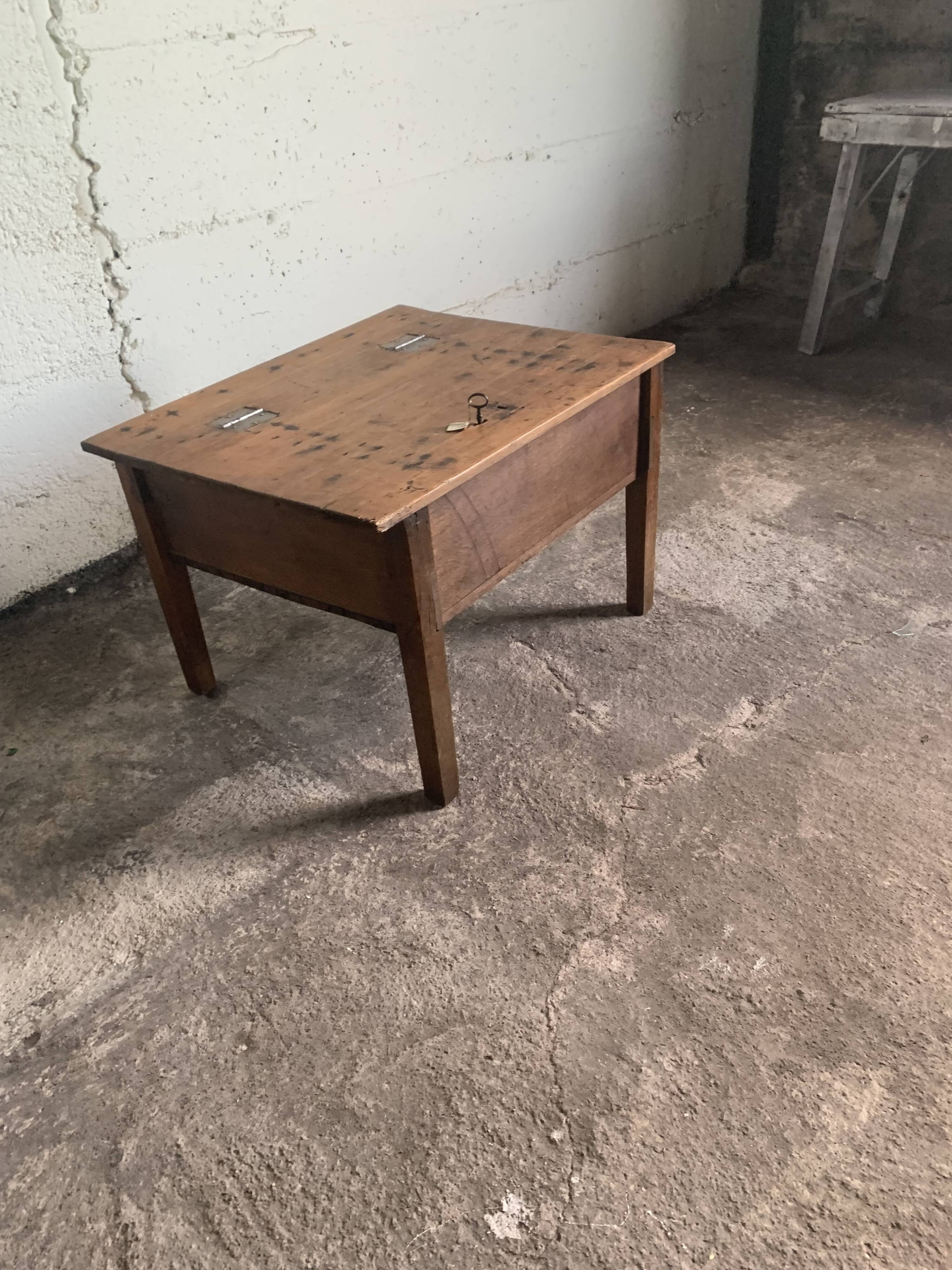 Coffee table with a key storage compartment.