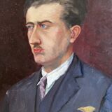 Old oil painting on cardboard portrait of a man in a blue suit