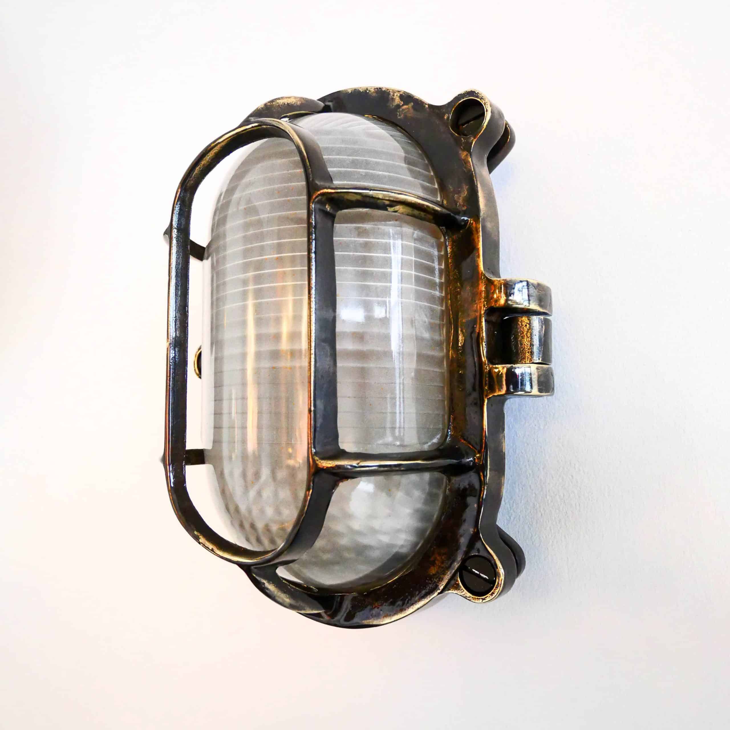 Antique Holophane wall lamp in patinated bronze