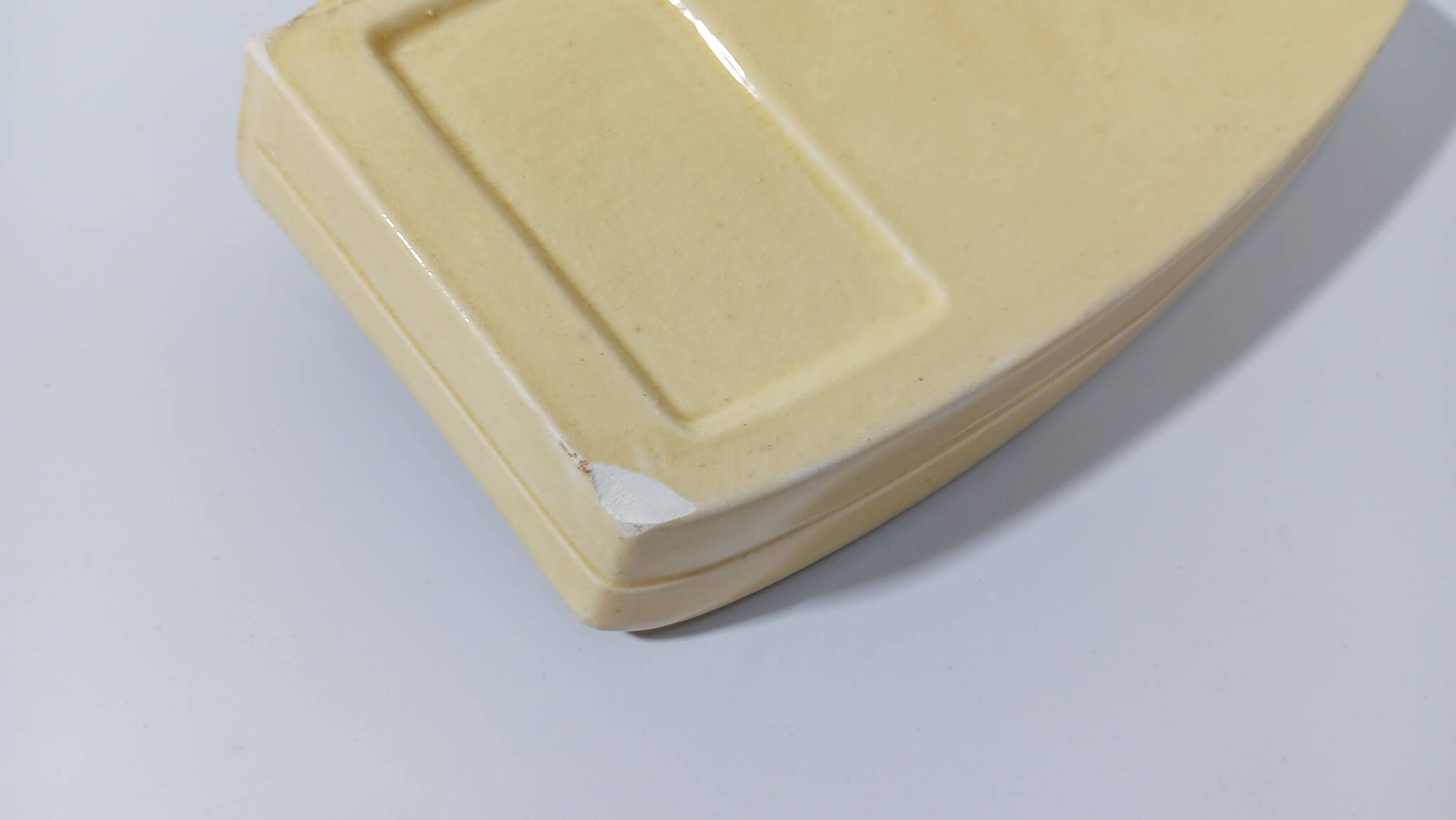 Pale yellow ceramic soap dish