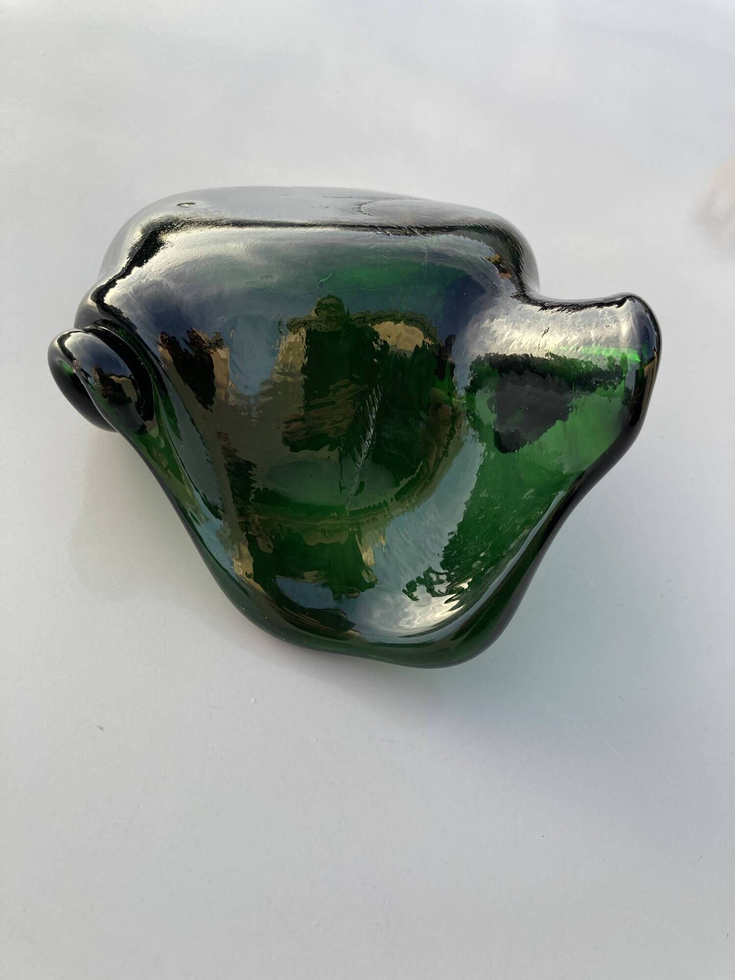 Sculptural ashtray in emerald green glass