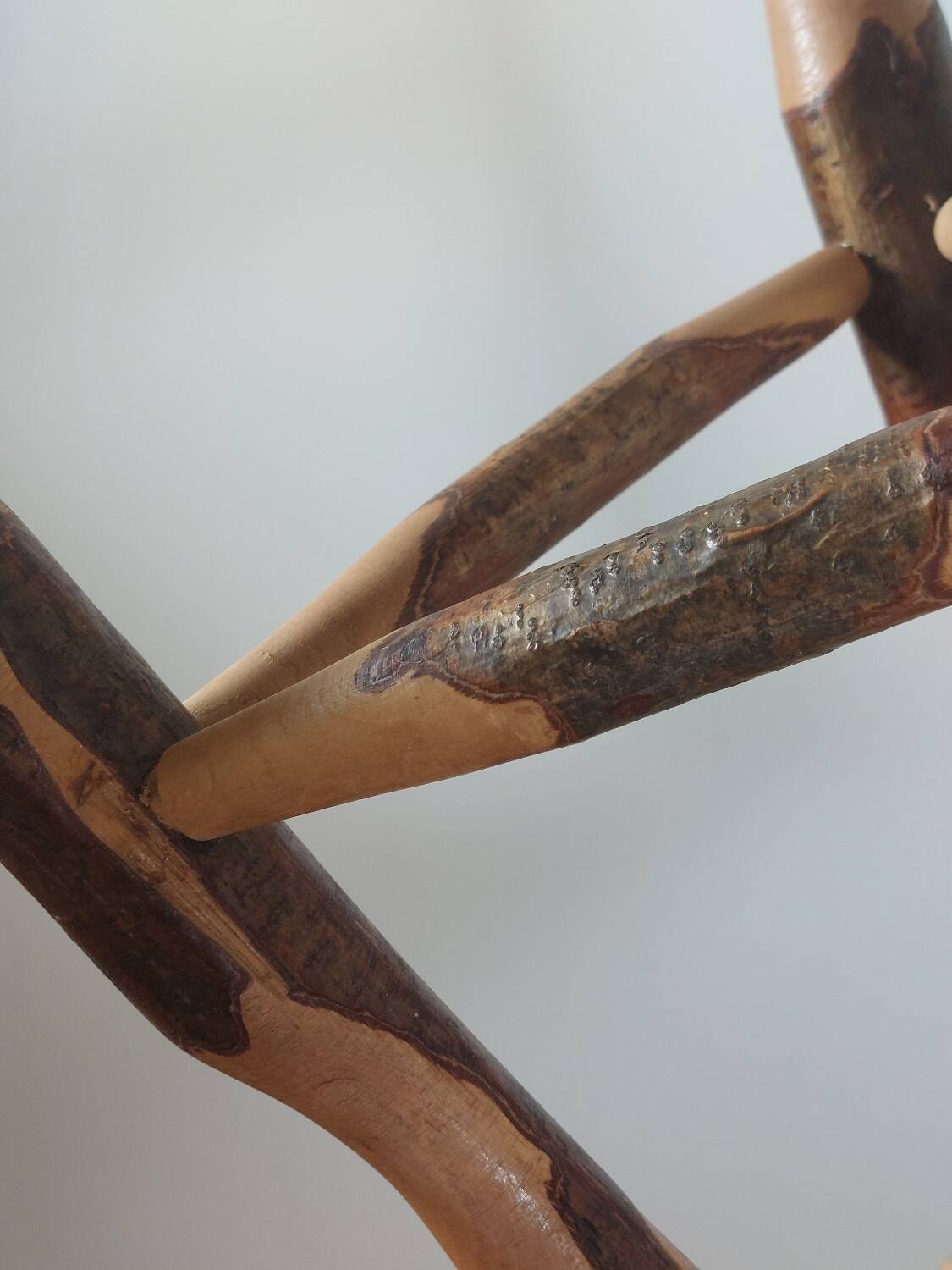 Pair of walnut stools sculpted in a vintage mid-century cross-section.
