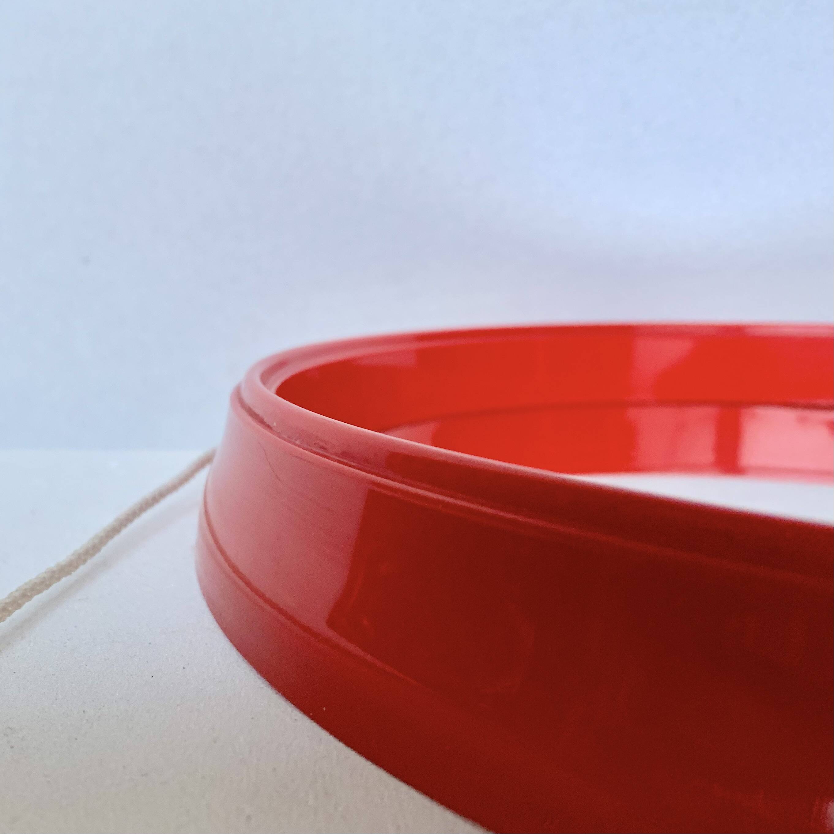 Pair of vintage round red plastic mirrors