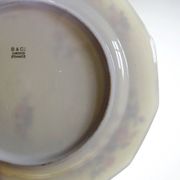 4 flat plates by Bernardaud, Limoges porcelain, floral decoration from the 1920s to 1950s.