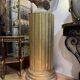 Large fluted golden wood column with a marble top, work from around 1900.