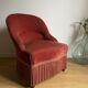 Fauteuil crapaud vintage rose framboise en velours à franges