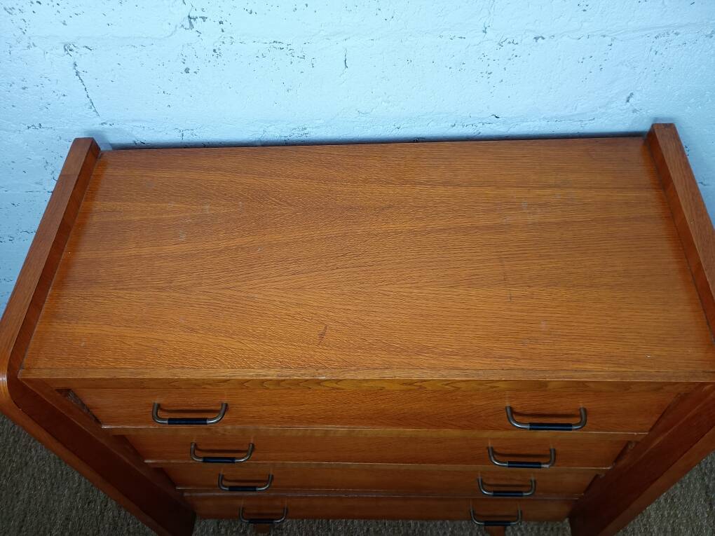 1950s 60s chest of drawers with four drawers and tapered legs.
