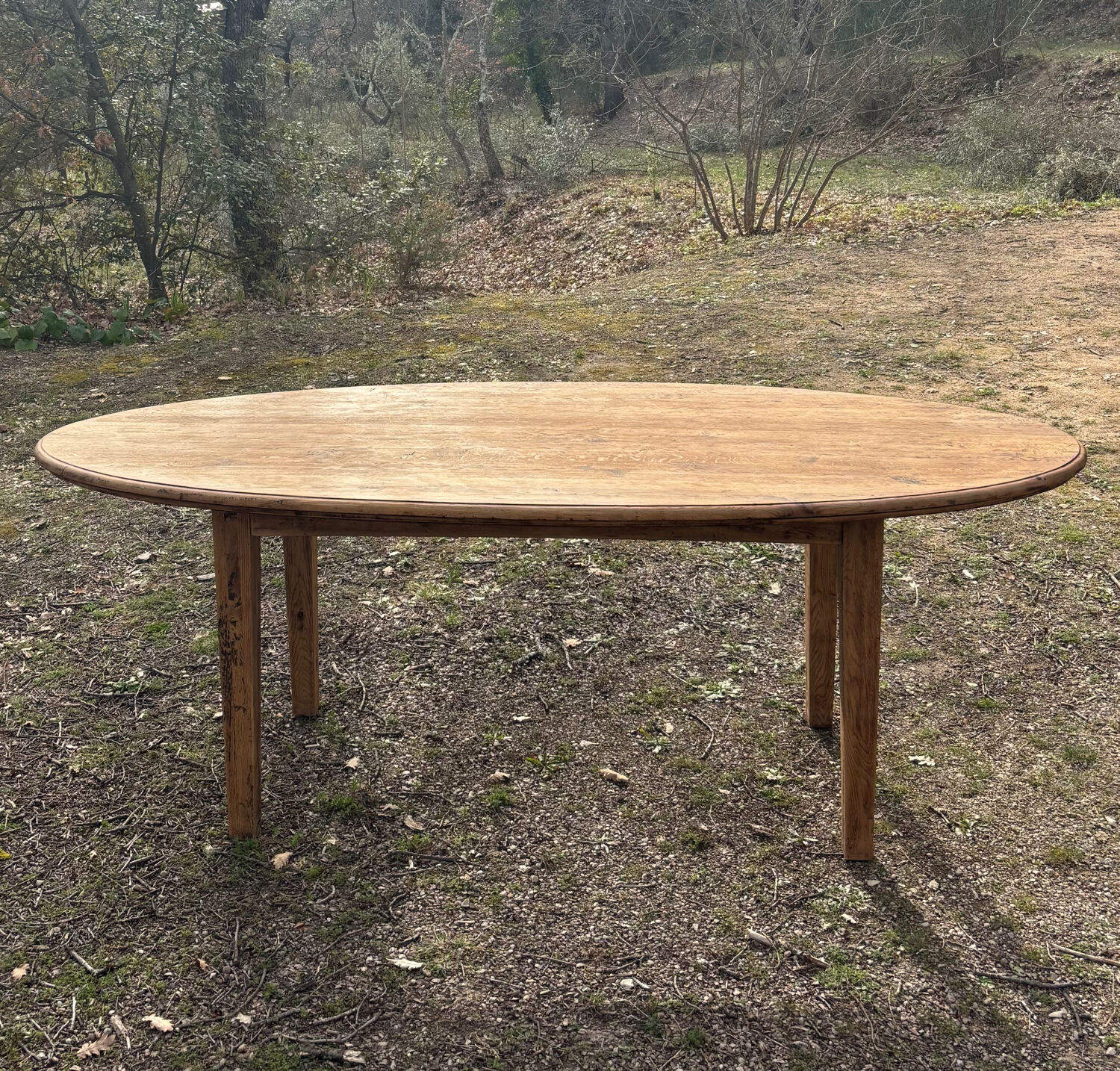 Oval solid wood dining table