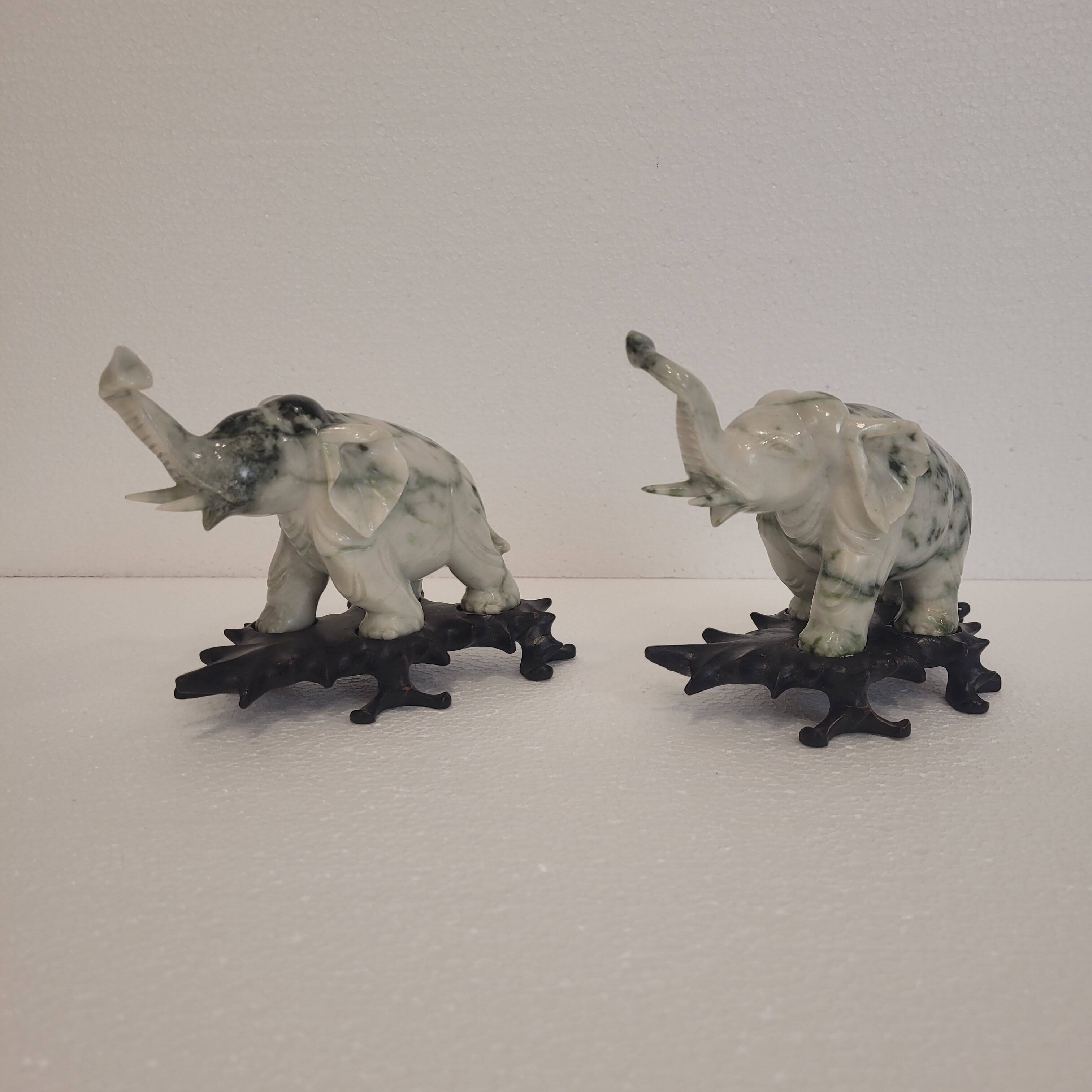 Pair of elephant paperweights, veined marble, 80s - France
