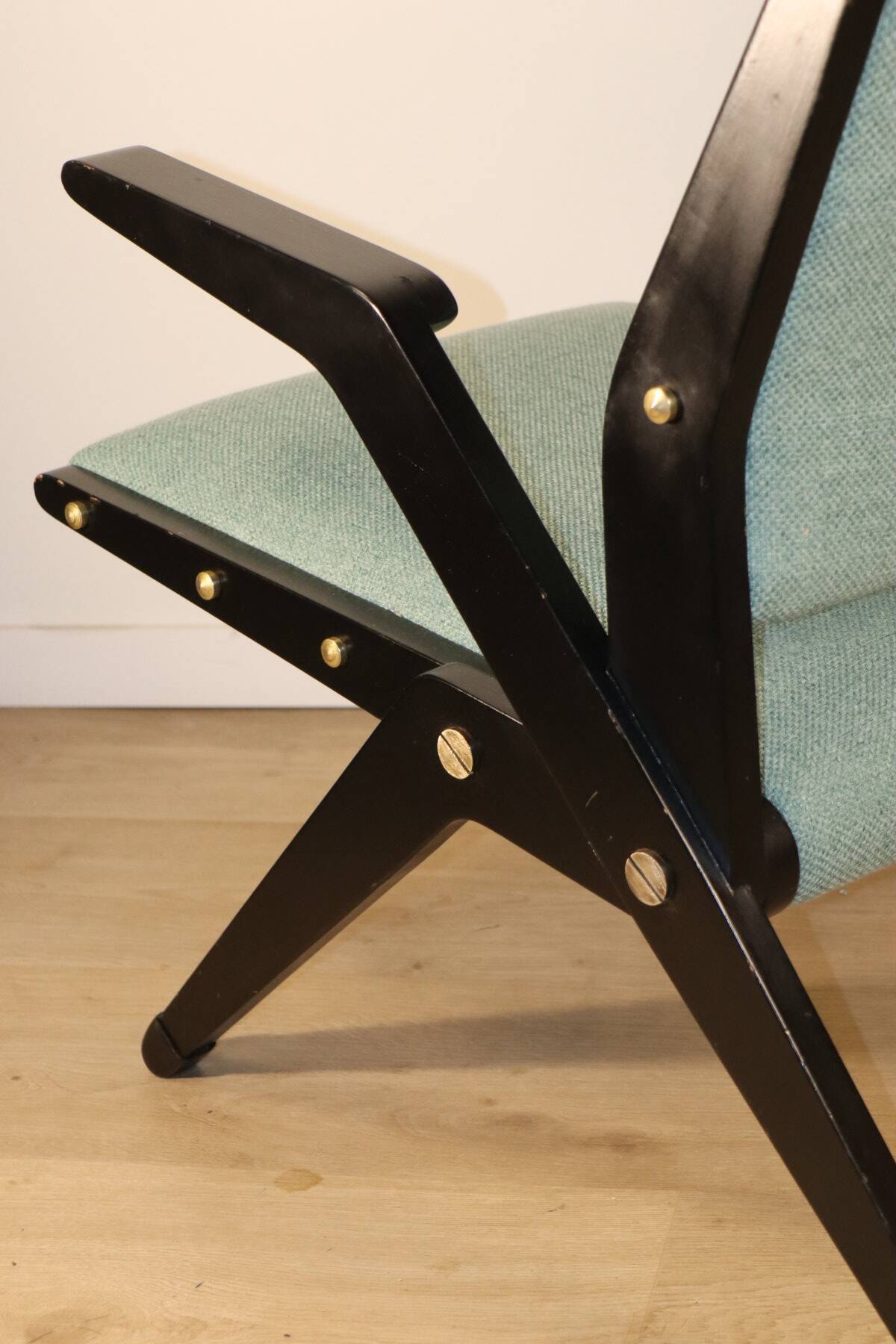 Vintage armchair from the 1960s in black wood and fabric.