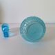 Old turquoise blue molded glass liqueur bottle and its cap