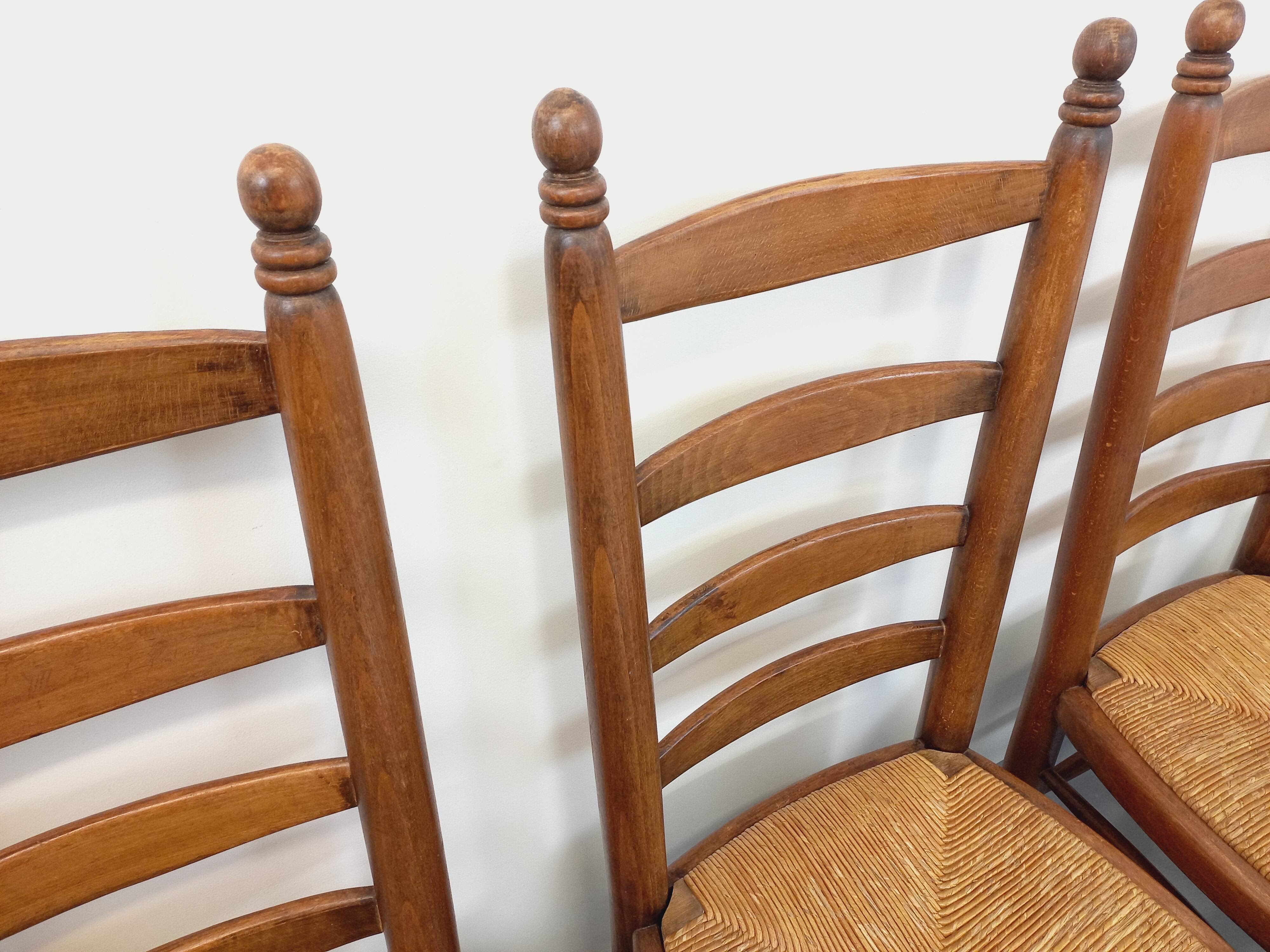 Set of 4 vintage brutalist Charles Dudouyt chairs in wood and straw from the 60s