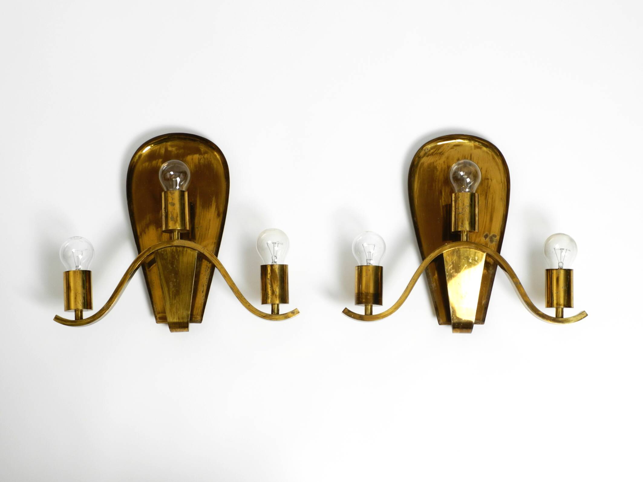 Pair of large heavy Mid Century brass wall lights from a German church