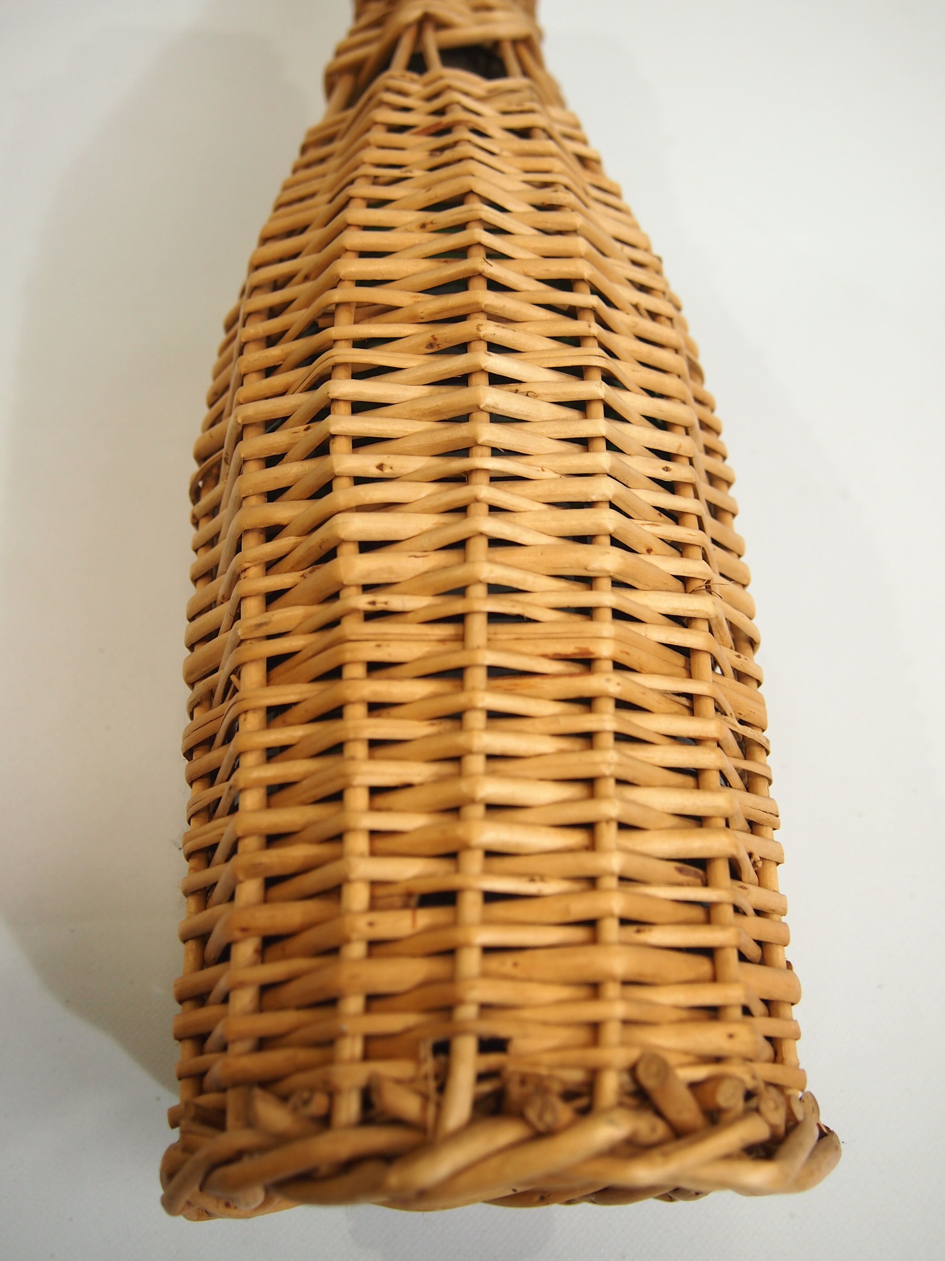 Bottle dressed in rattan