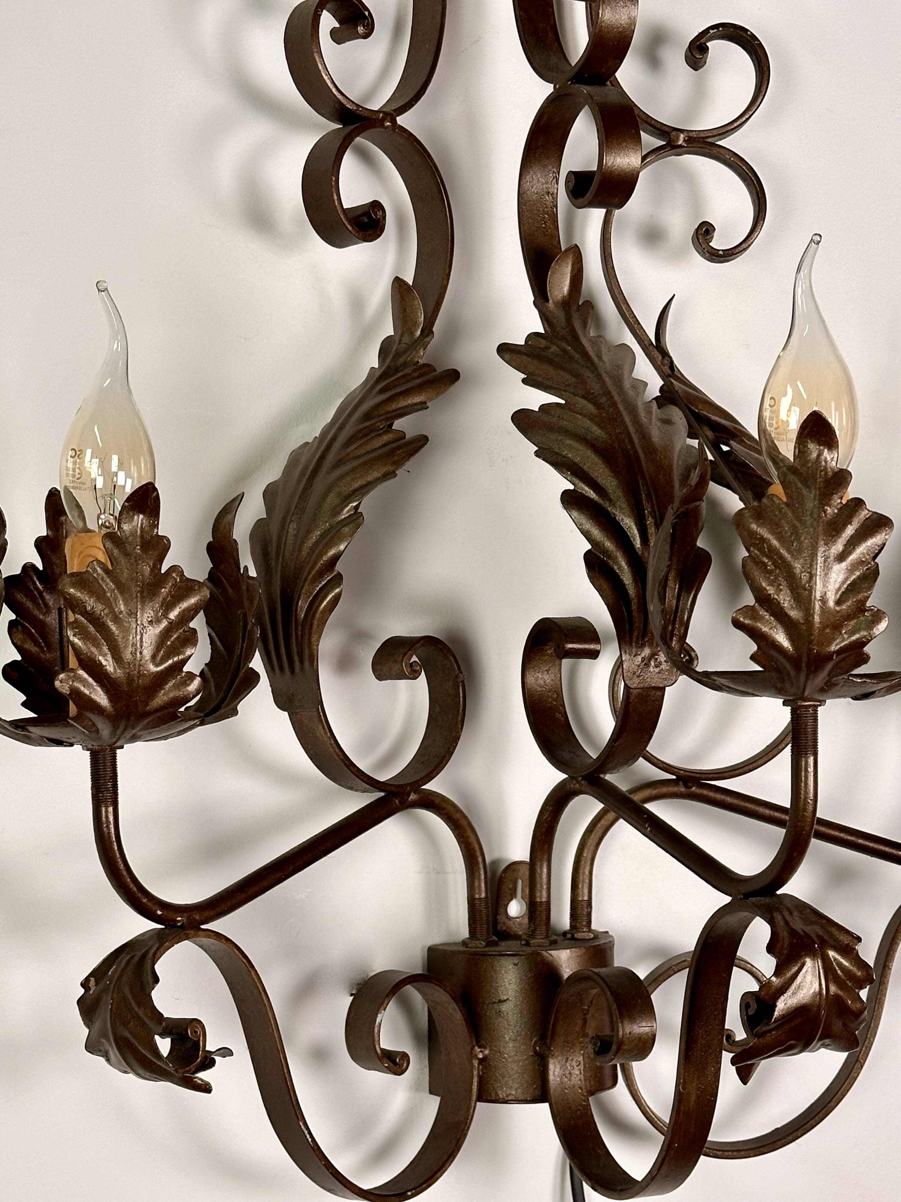 Wrought iron wall lights (pair) with foliage decoration