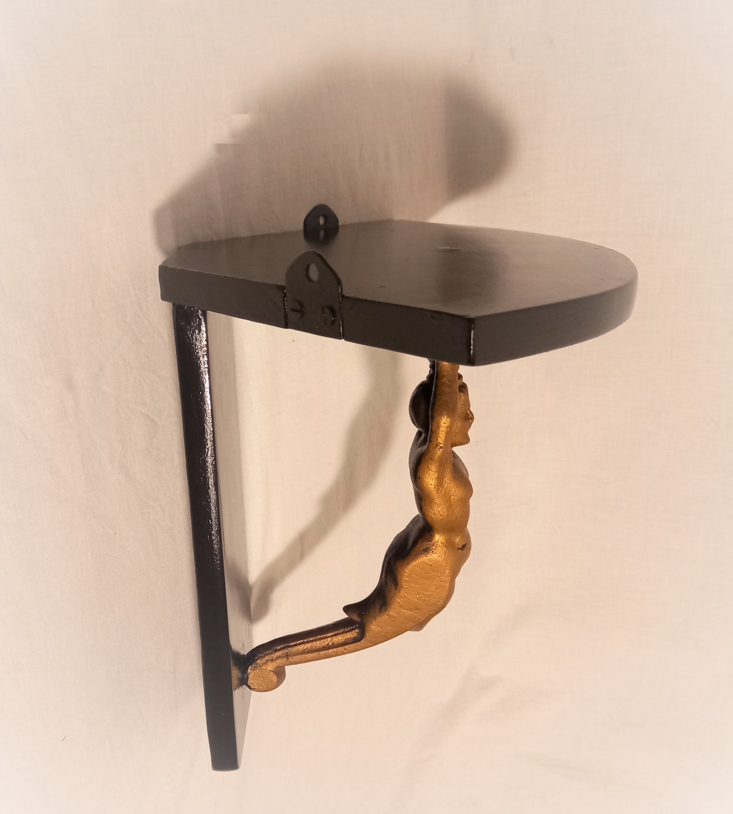 Corner wall lamp console with a golden cast iron djinn