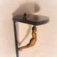 Corner wall lamp console with a golden cast iron djinn