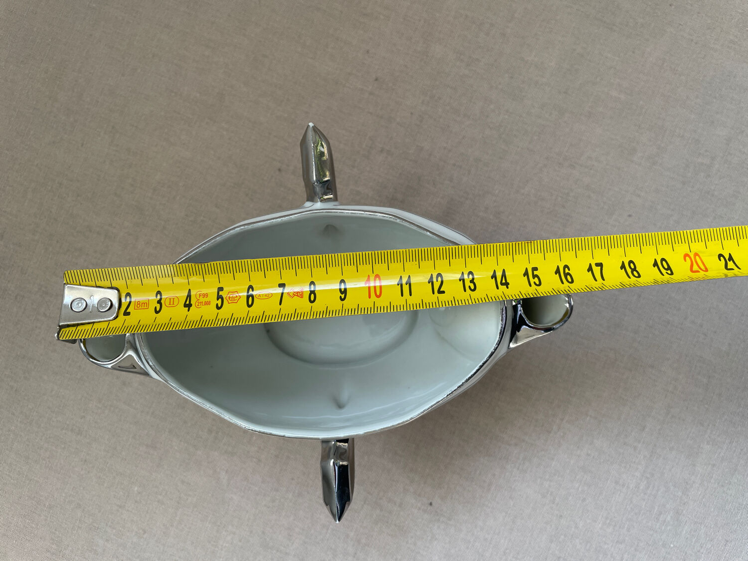 Antique white French porcelain sauce boat M&S with silver trim.