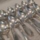 12 silver-plated dessert spoons with rocaille ribbon decoration, 18.5 cm