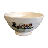 Old bowl decorated with a farmer and her cow