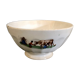 Old bowl decorated with a farmer and her cow
