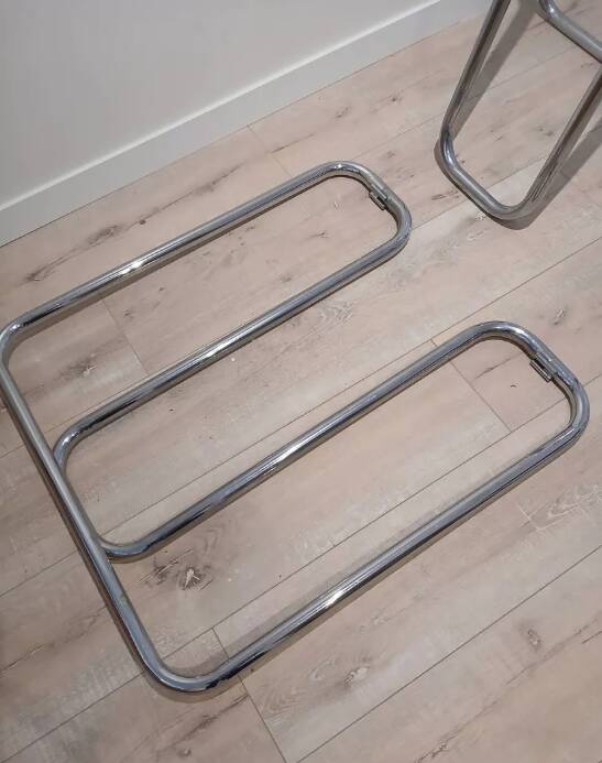 Smoked glass desk on tubular chrome trestles, 1970s design.