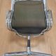 Vitra Aluminium Group EA 108 armchair, iconic design by Charles & Ray Eames.