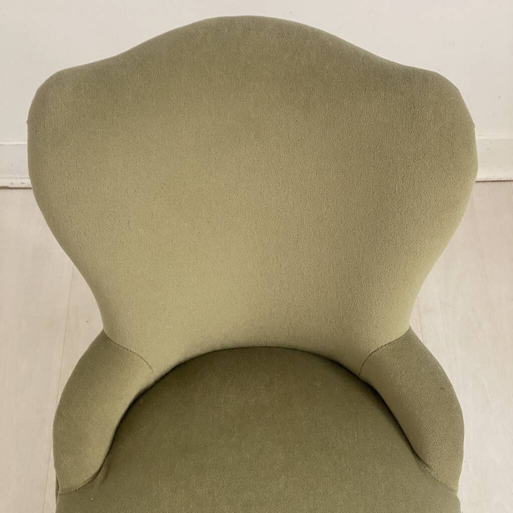 Small green velvet tub chair