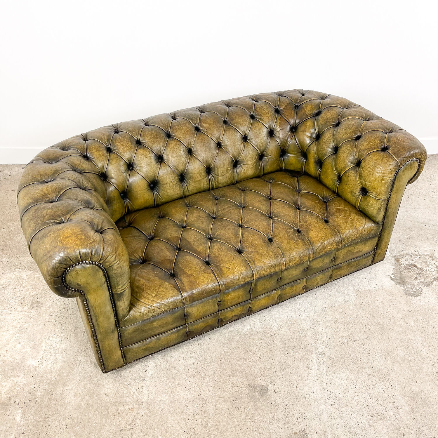 Old vintage leather chesterfield sofa