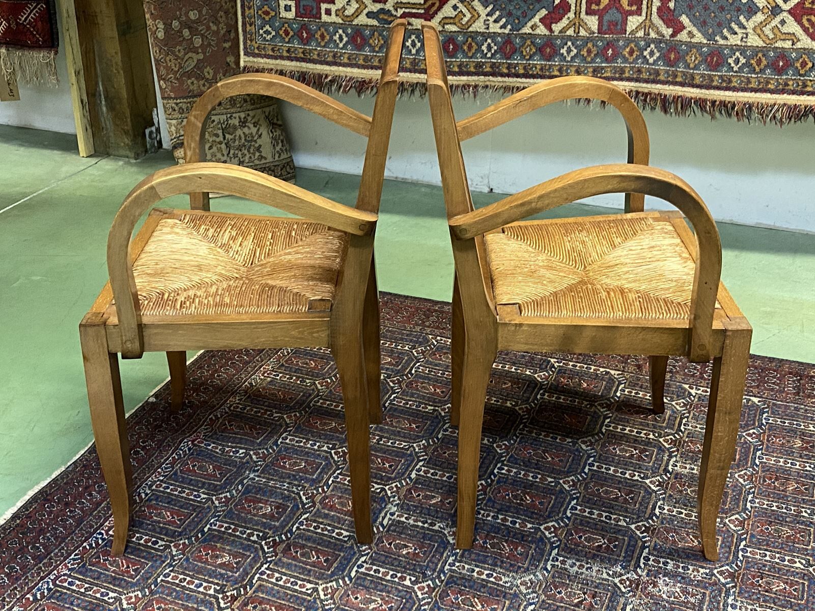 Pair of beech and straw armchairs