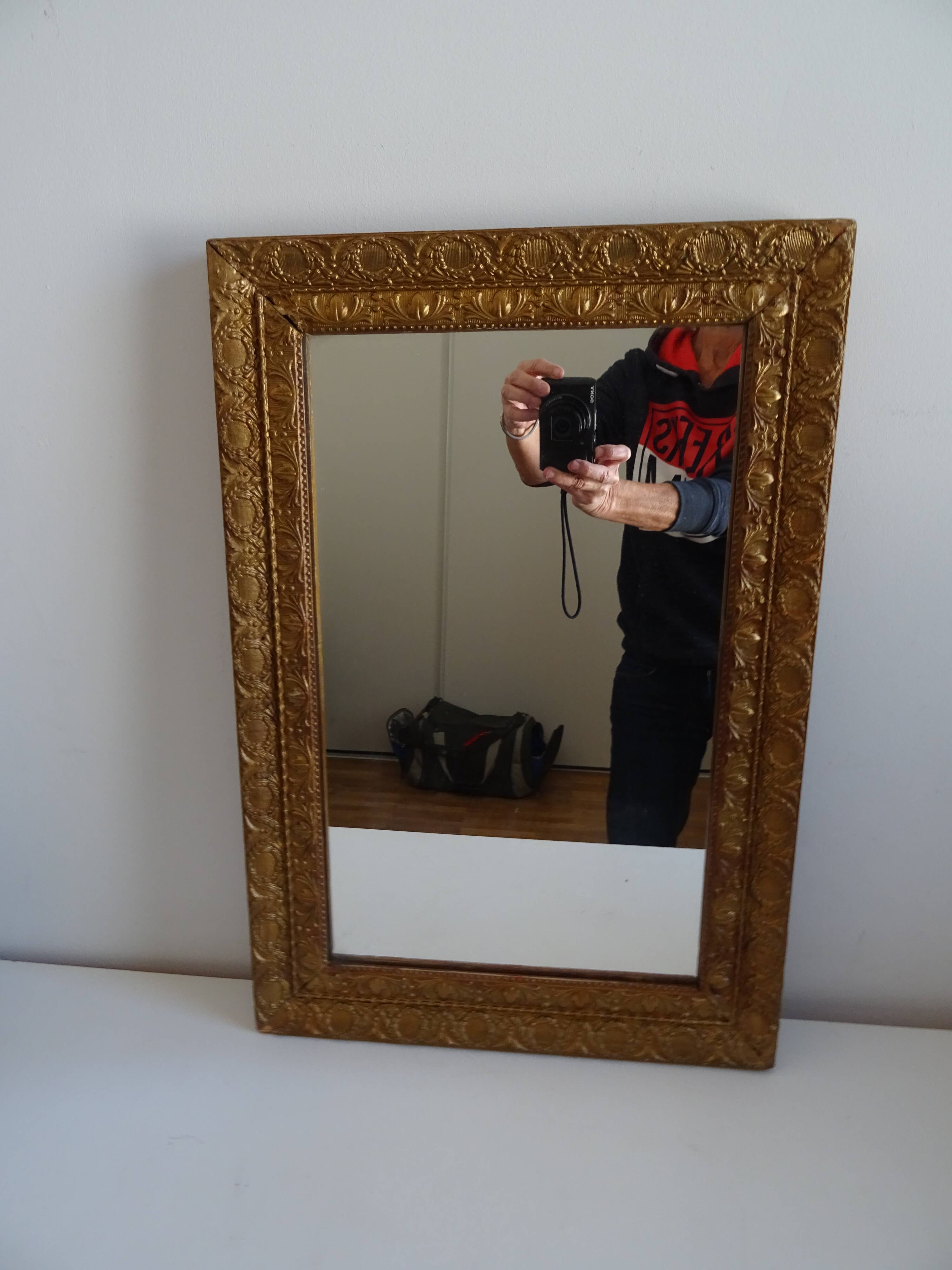 Wood and gilded stucco wall mirror