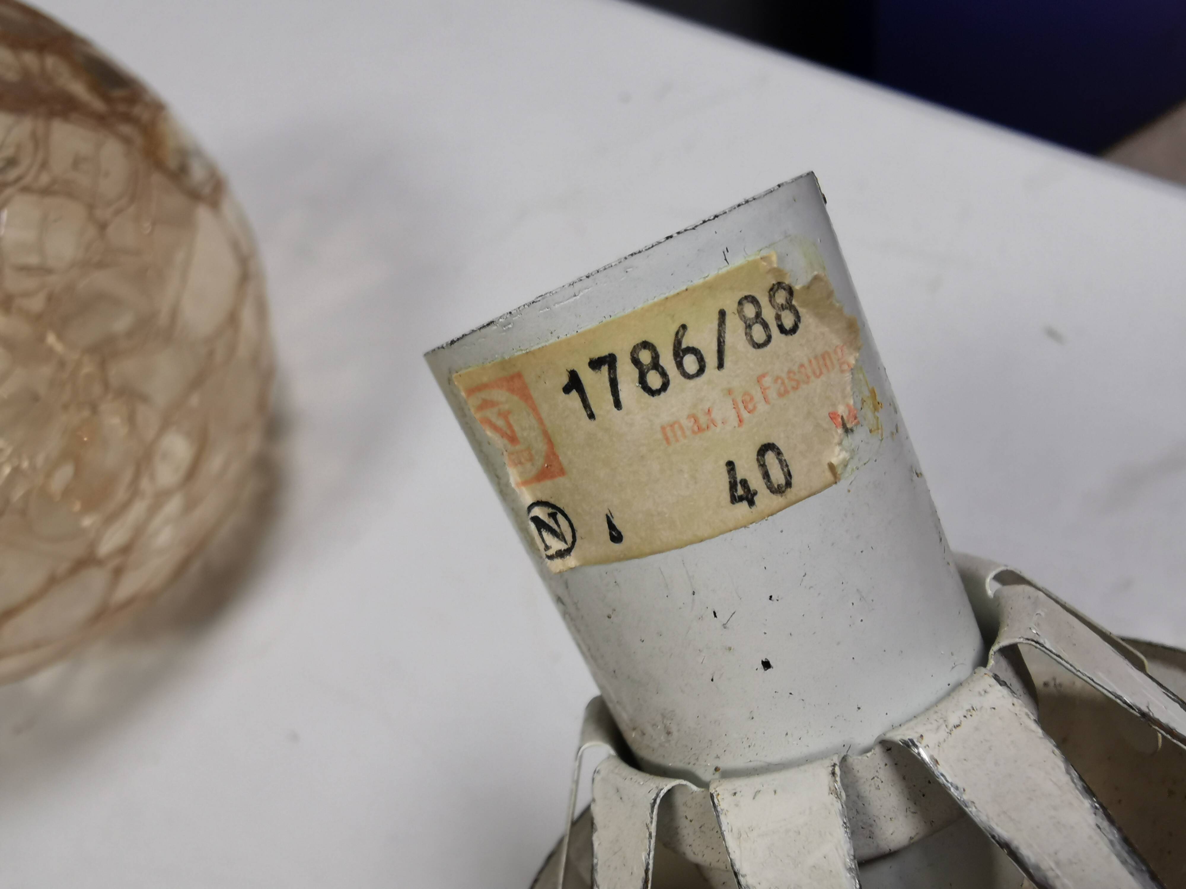 Older wall lamp in metal, brass and “cracked” glass.