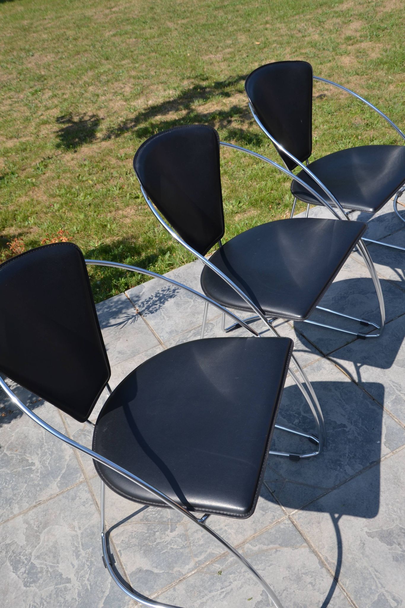 4 chrome and leather chairs designed by Italy
