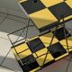 Vintage black and yellow checkered rolling bar trolley