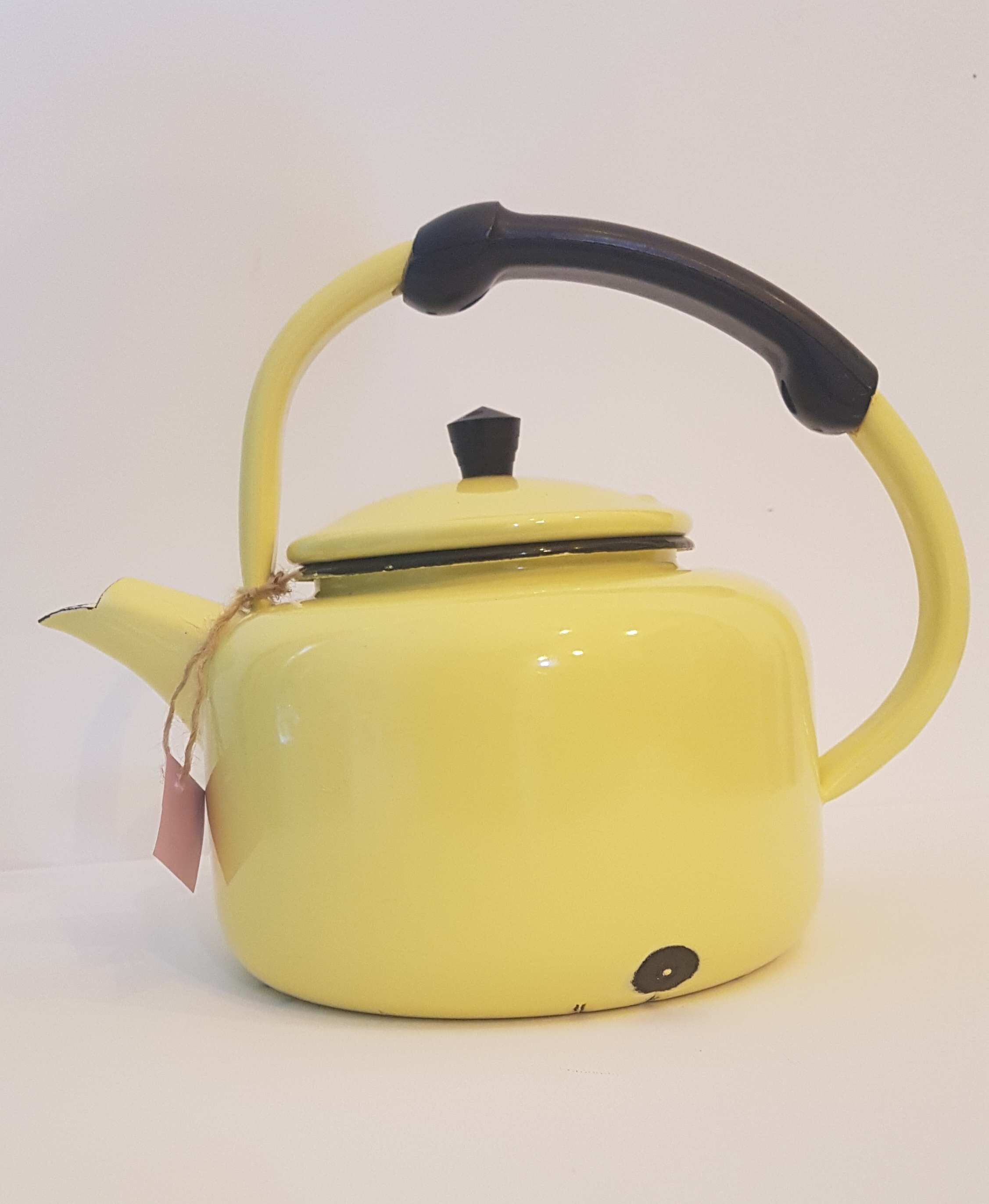 Old kettle enamelled pale yellow