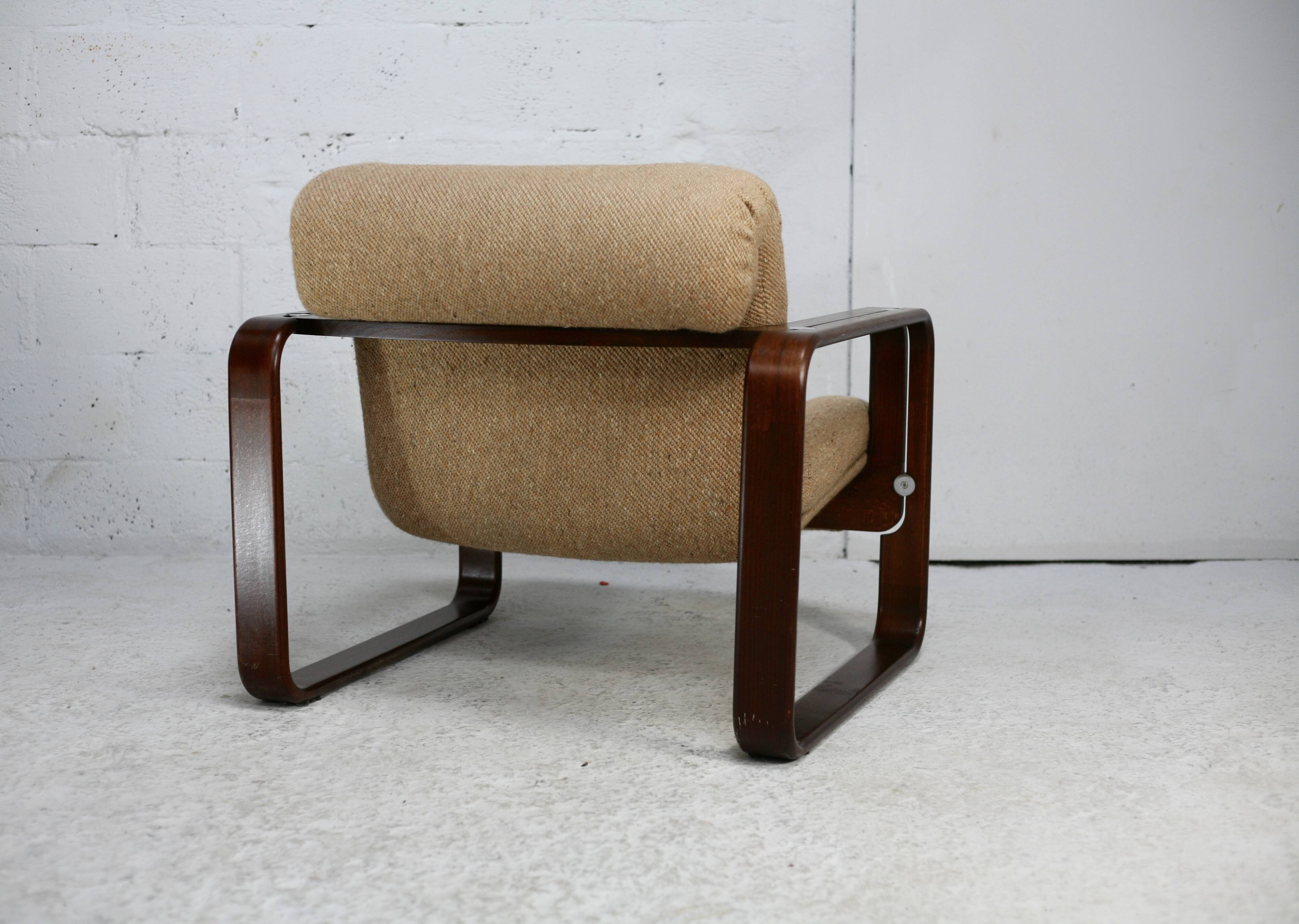 Modernist armchair. Wool, wood and steel. Circa 1970