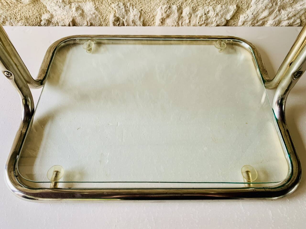 Glass and brass side table with magazine rack, circa 1970's