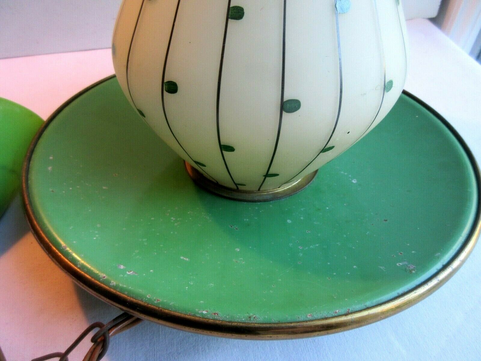 Green sheet metal and globe glass hanging lamp