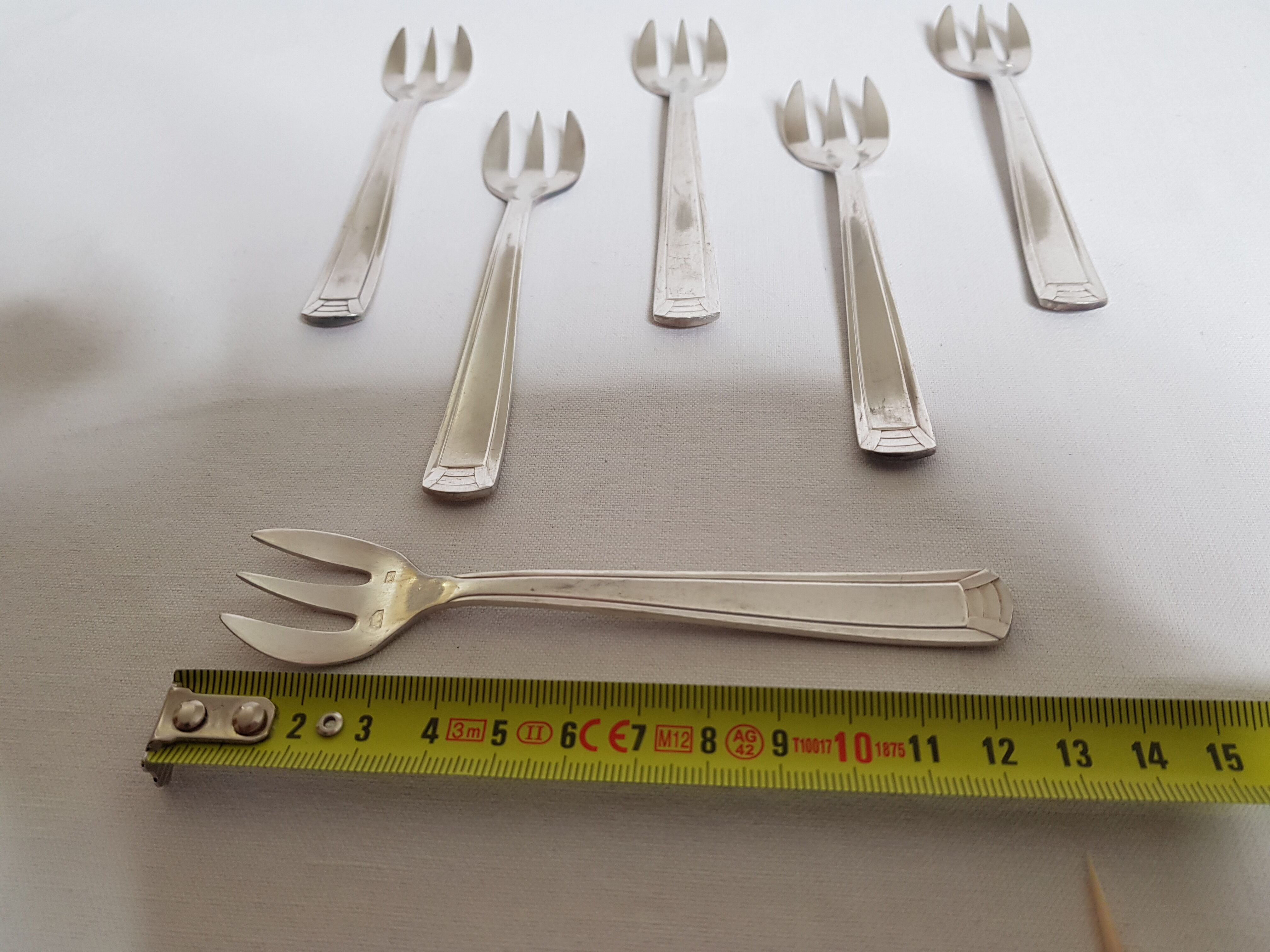 Six art deco silver metal oyster forks