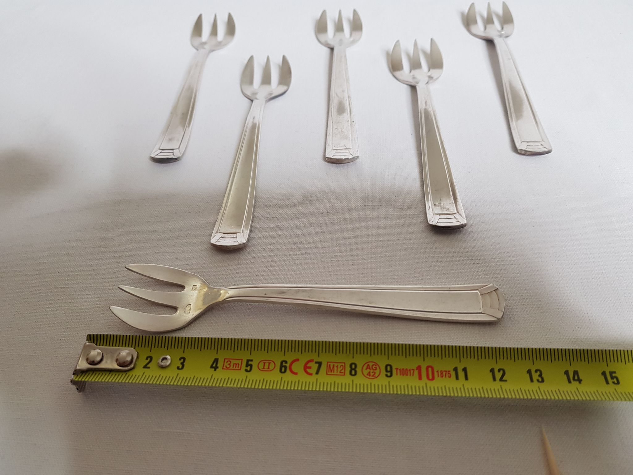 Six art deco silver metal oyster forks