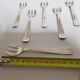 Six art deco silver metal oyster forks
