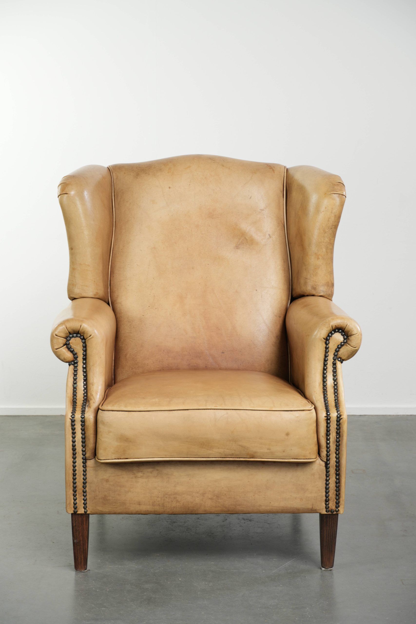 Cow leather wingback armchair with a beautiful timeless English look