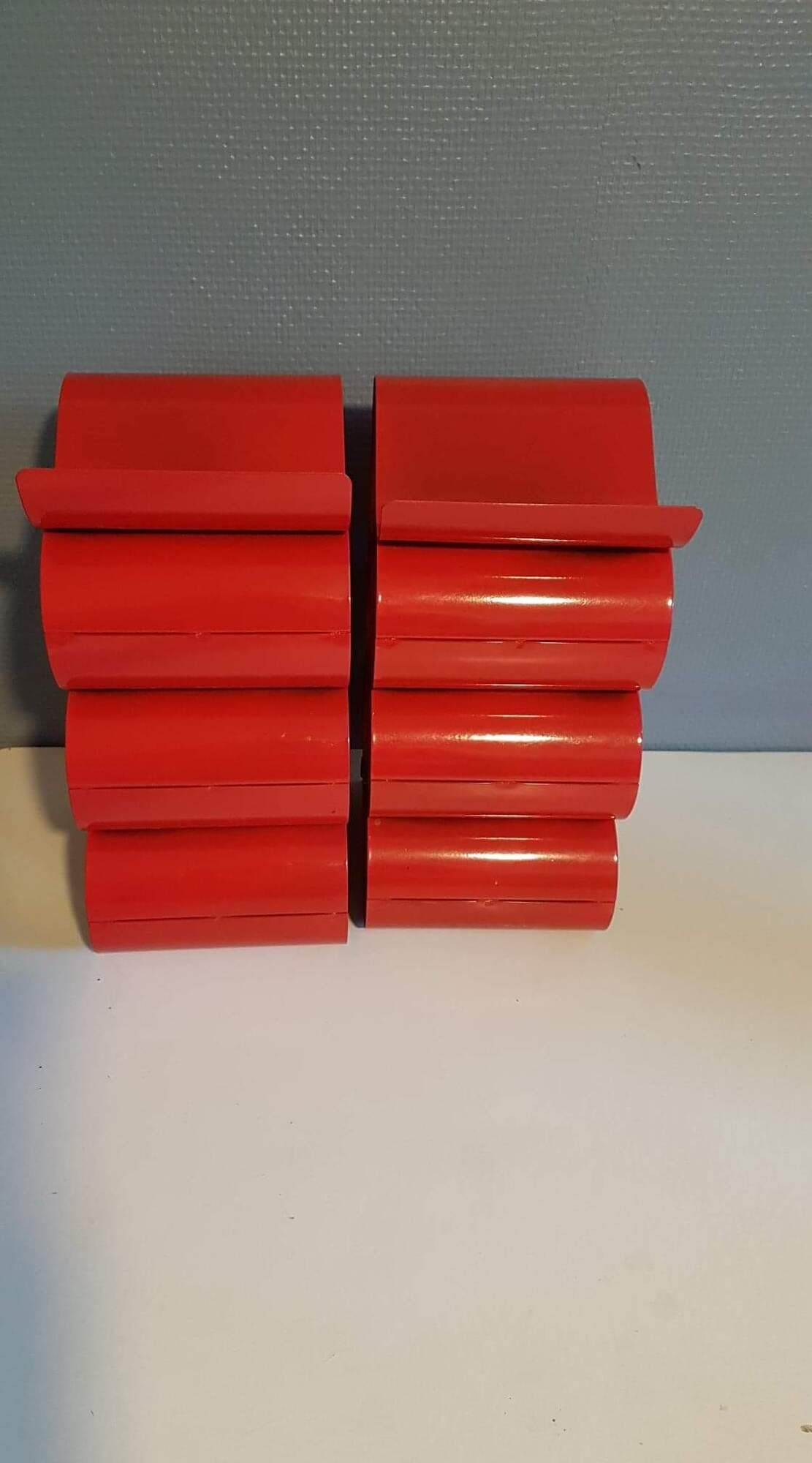 Pair of red metal bottle holders from the 80s