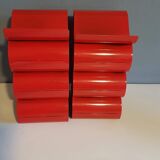 Pair of red metal bottle holders from the 80s